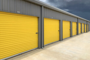 Exterior of a commercial warehouse with yellow roller doors