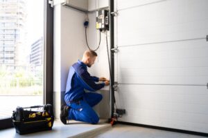 Emergency Garage Door Repair Franklin TN A garage door repairman working on a garage door repair.