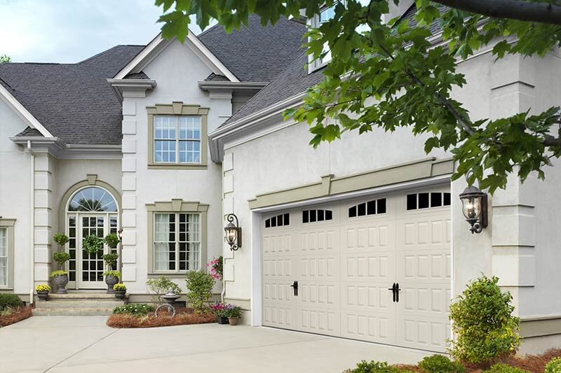 White residential home with two-door garage.