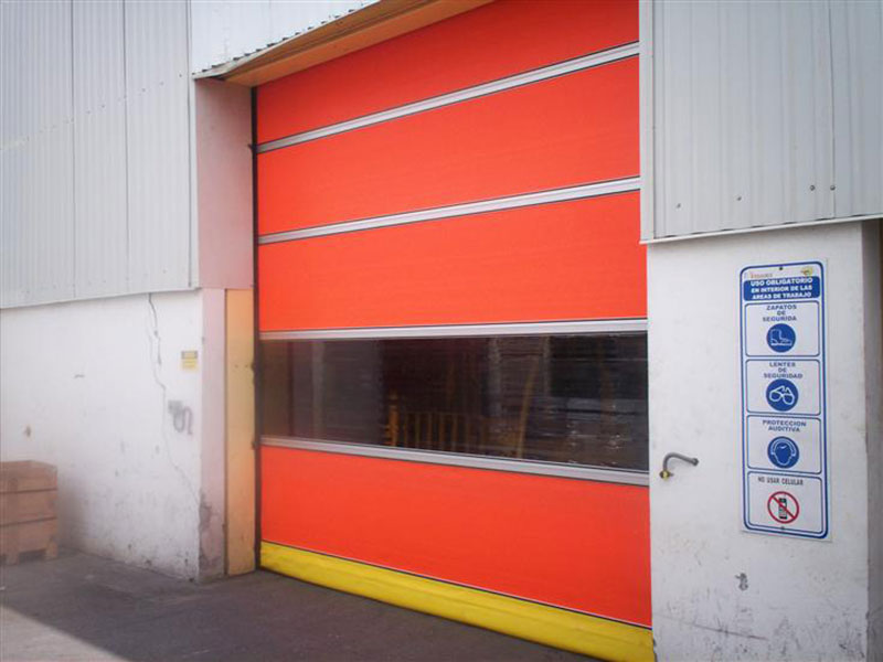 Orange commercial garage partially opened.