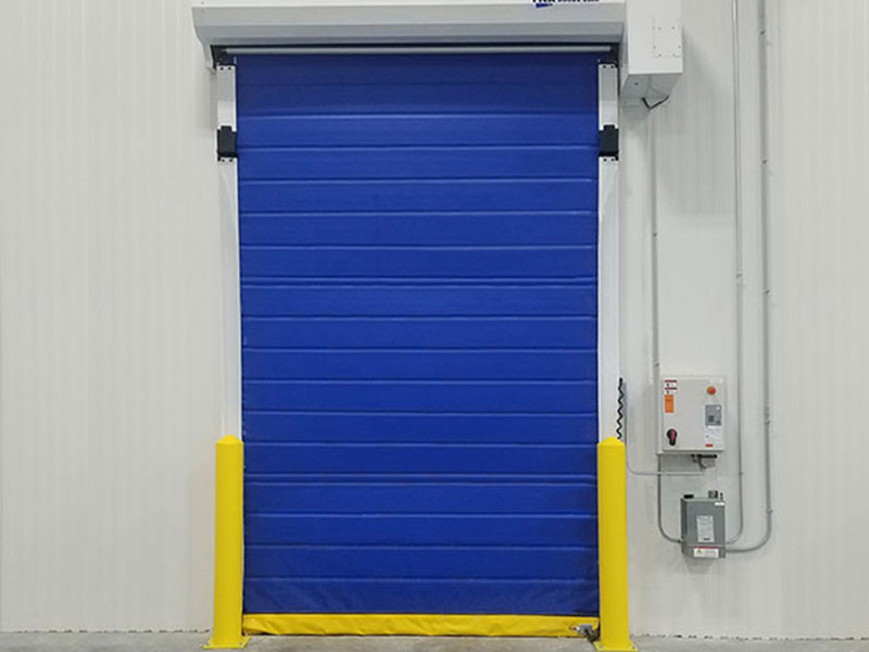 A blue commercial garage door in a warehouse.